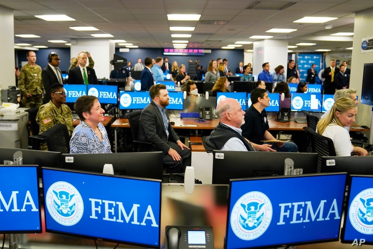 FEMA employees listen to President Joe Biden talk at FEMA headquarters, Monday, May 24, 2021, in Washington. (AP Photo/Evan…
