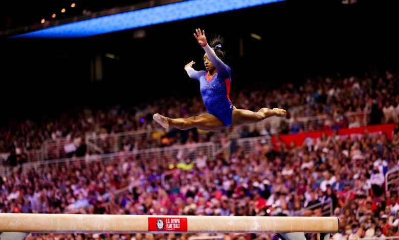 Simone Biles competes on beam during day 2 of the women's 2021 U.S. Olympic Trials on June 25, 2021, in St Louis, Missouri. / GETTY IMAGES