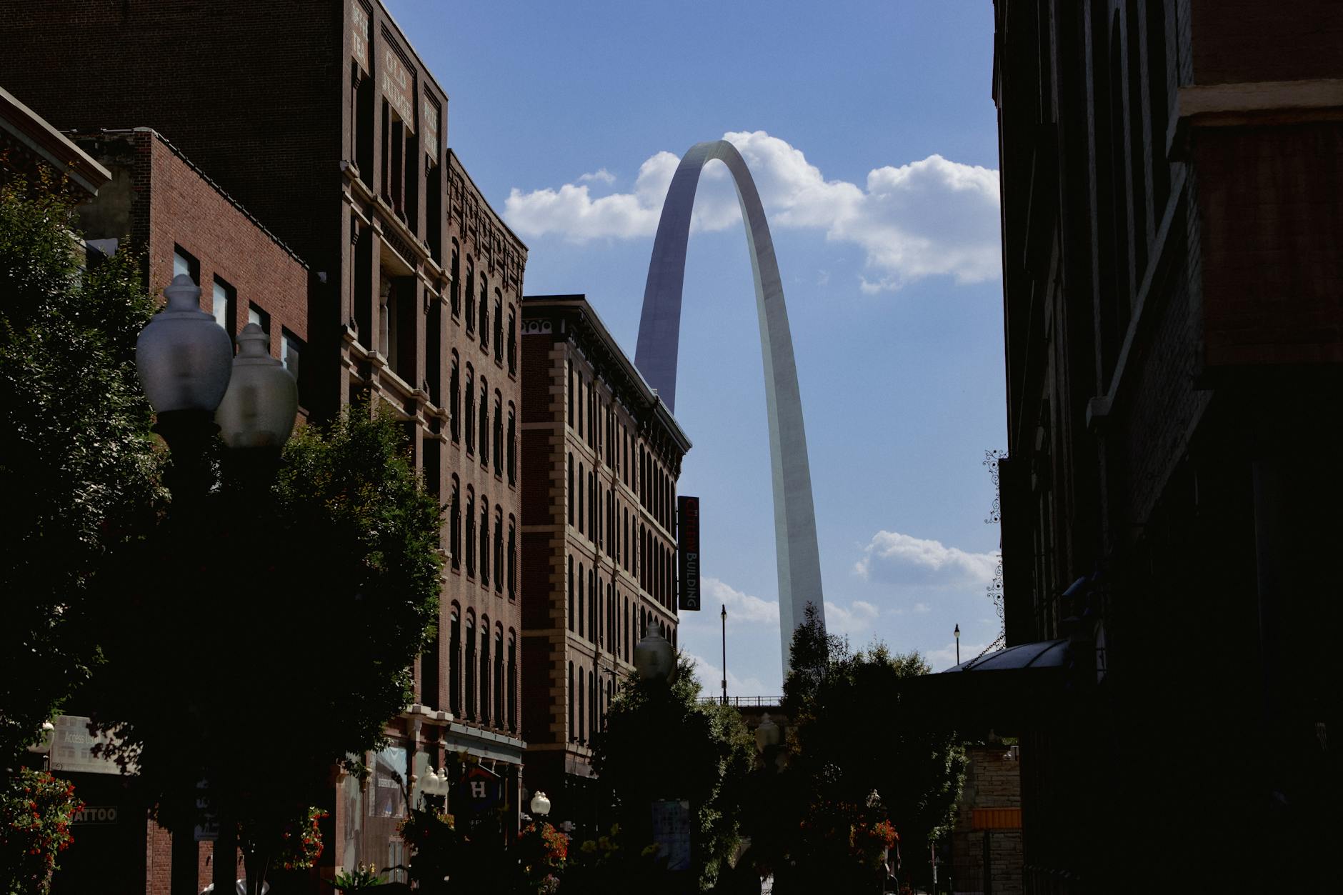 st louis gateway arch framed by urban buildings