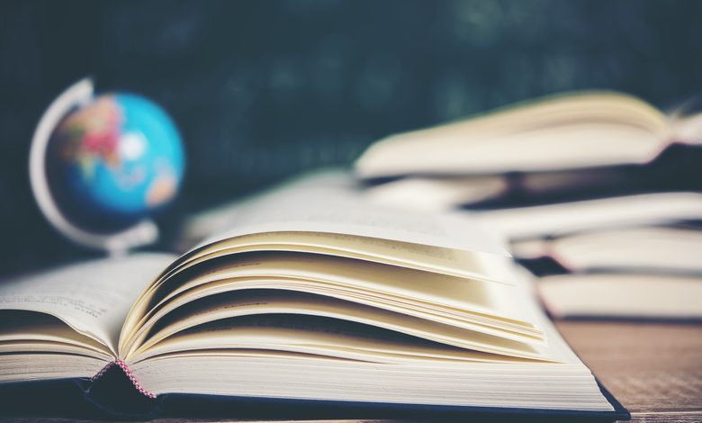 Open book with green board background